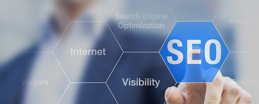 Search Engine Optimization consultant touching SEO button on whiteboard